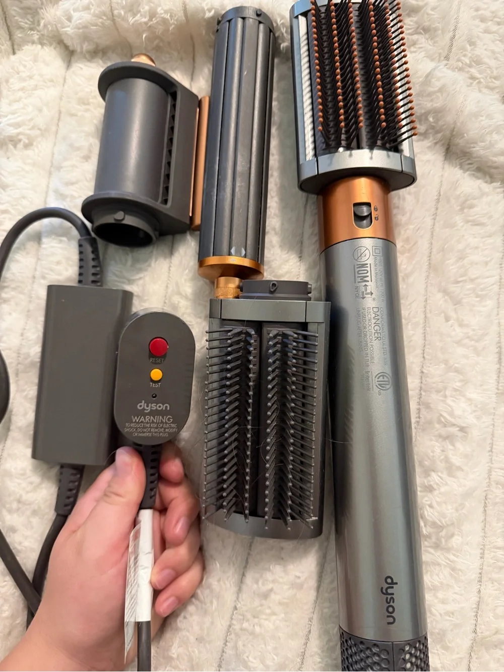 Dyson styling brush set in gunmetal gray and copper accents
